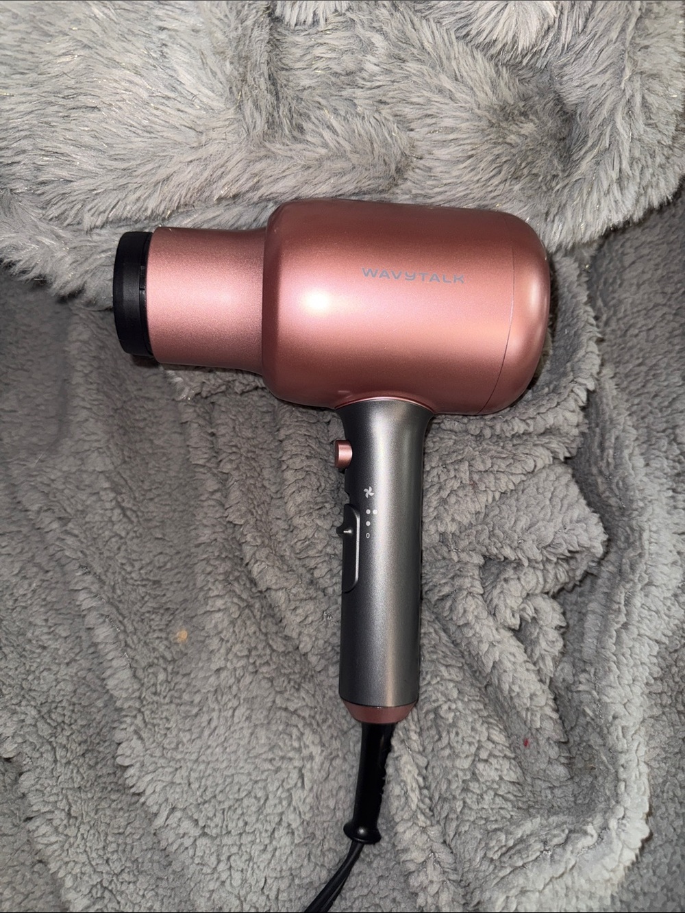 Wavytalk Rose Gold Mini Hair Dryer comes with attachments shown.